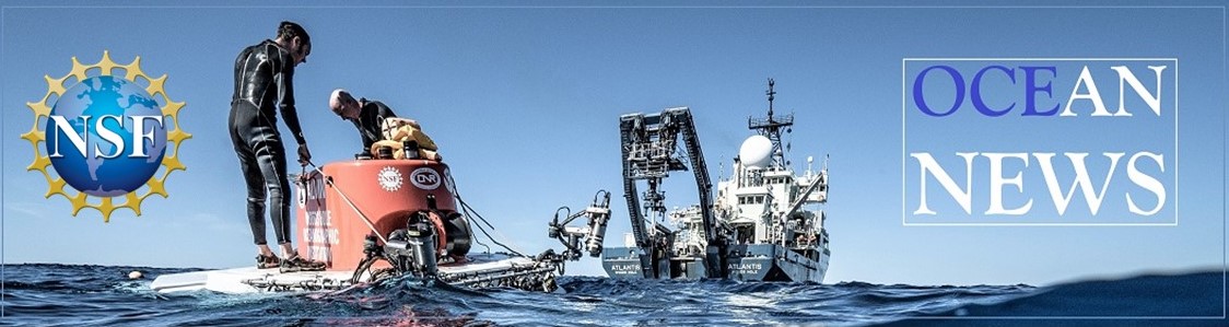 Image of the Alvin submersible at sea with two crew standing on top, and the research vessel in the background